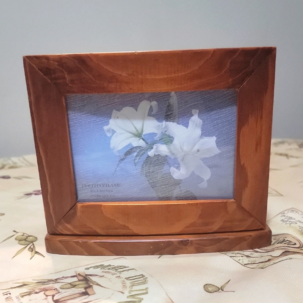 Rotating Wooden Photo Frame Storage Box in good condition.